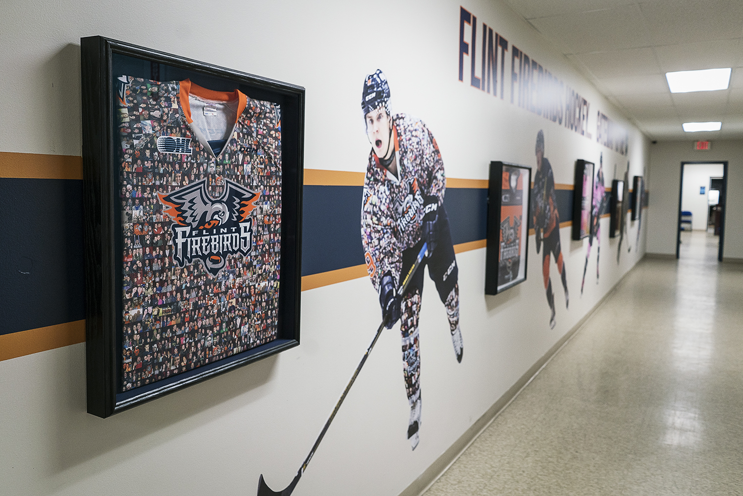Flint, MI - Tuesday, January 30, 2018: The administration area hallways are decorated with past and present jerseys of the Flint Firebirds at the Dort Federal Event Center.