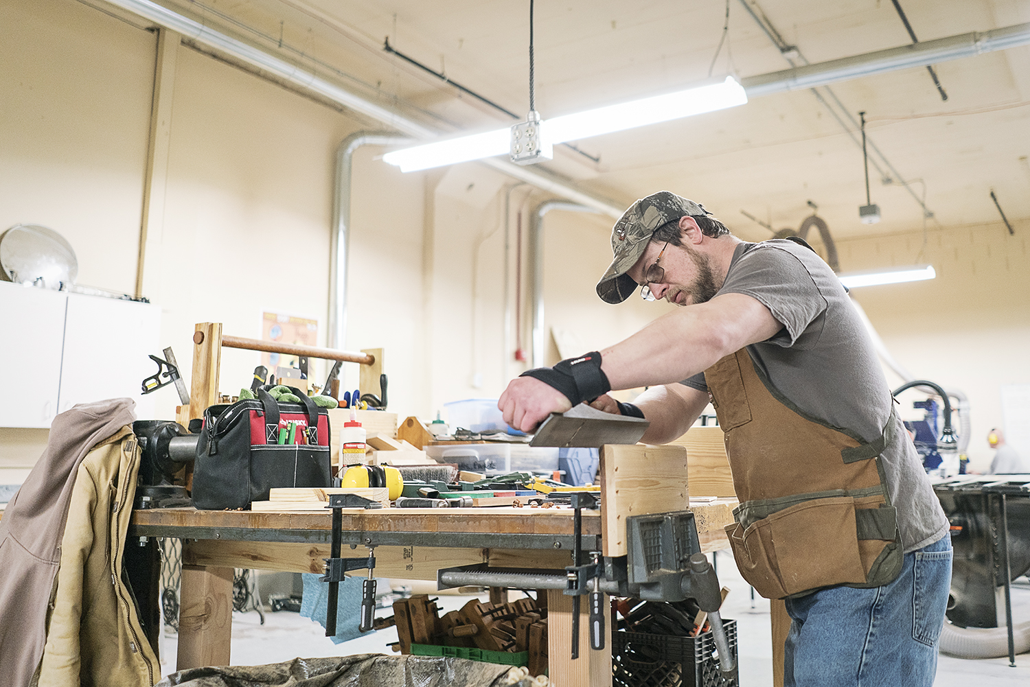 Flint, MI - Friday, February 2, 2018: Michael Callahan from Flint rounds the edges of a couple of panels for a cabinet he is building at Factory Two in Flint.