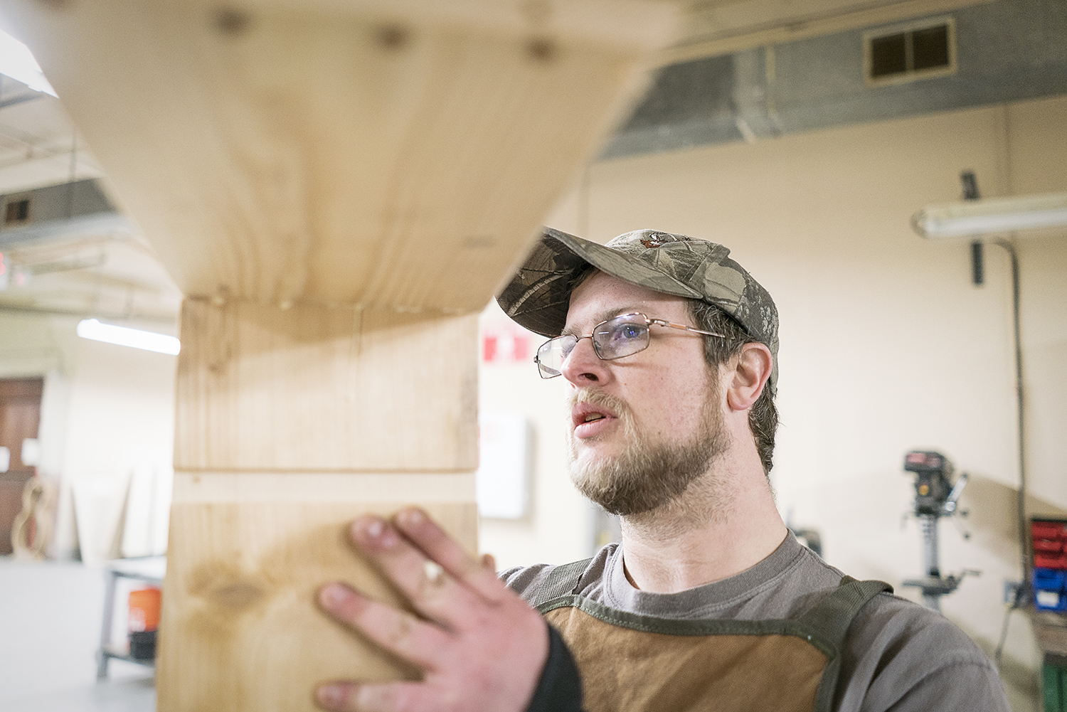 Flint, MI - Friday, February 2, 2018: Flint resident Michael Callahan ensures his corner is square as the wood glue sets on a cabinet he is building at Factory Two in Flint.