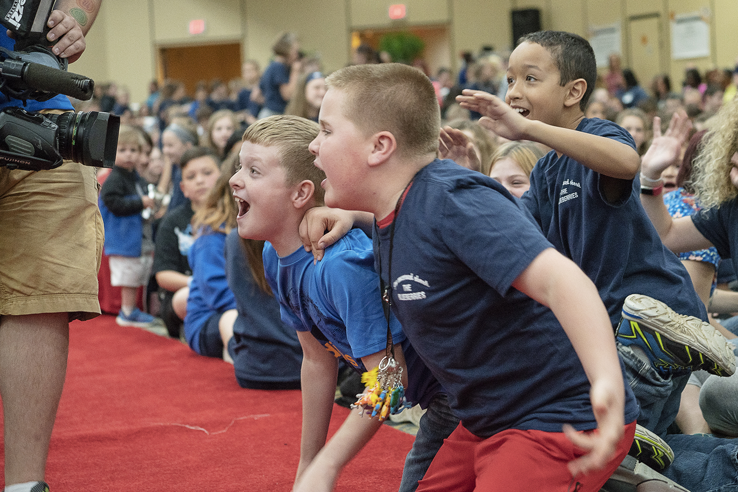 Flint, MI - Friday, May 4, 2018: Enthusiastic Blueberry Ambassadors cheer and jeer at the camera before the show begins at the 5th Annual Blueberry Ambassador Party at the Riverfront Banquet Center downtown.