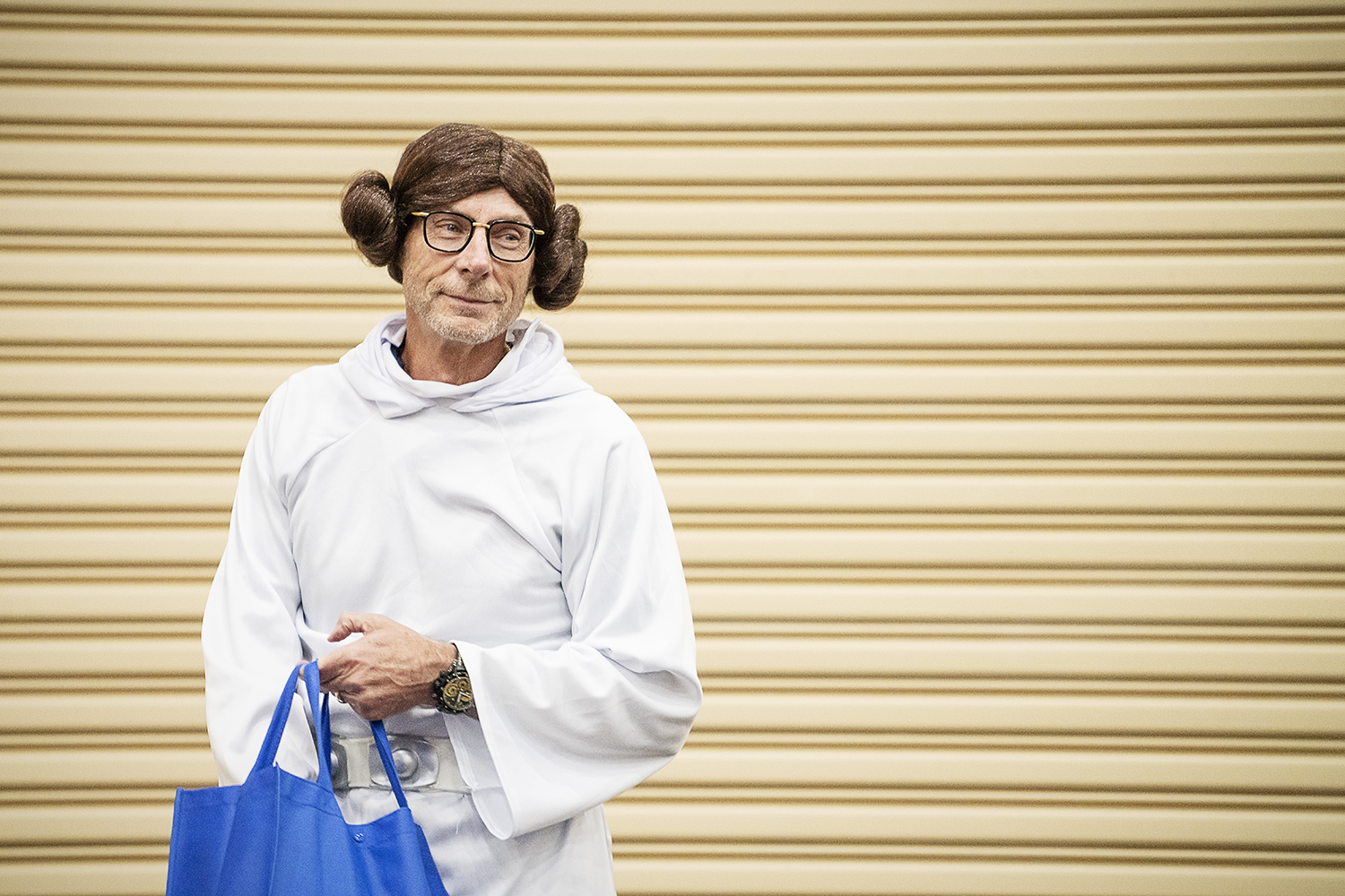 Flint, MI - Friday, May 4, 2018: Fenton Twp. Resident and Blueberry Founder Phil Shaltz, 69, looks across the crowd of Blueberry Ambassadors while dressed as Princess Leia from Star Wars before handing out blueberry-replica stress balls during the 5t