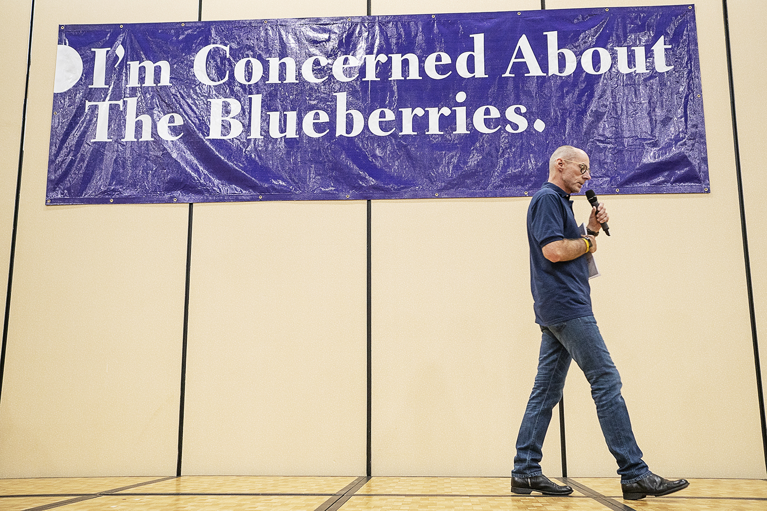 Flint, MI - Friday, May 4, 2018: Fenton Twp. resident Phil Shaltz, 69, Blueberry Founder, paces on the stage as he speaks to the Blueberry Ambassadors during the 5th Annual Blueberry Ambassador Awards Party at the Riverfront Banquet Center downtown.