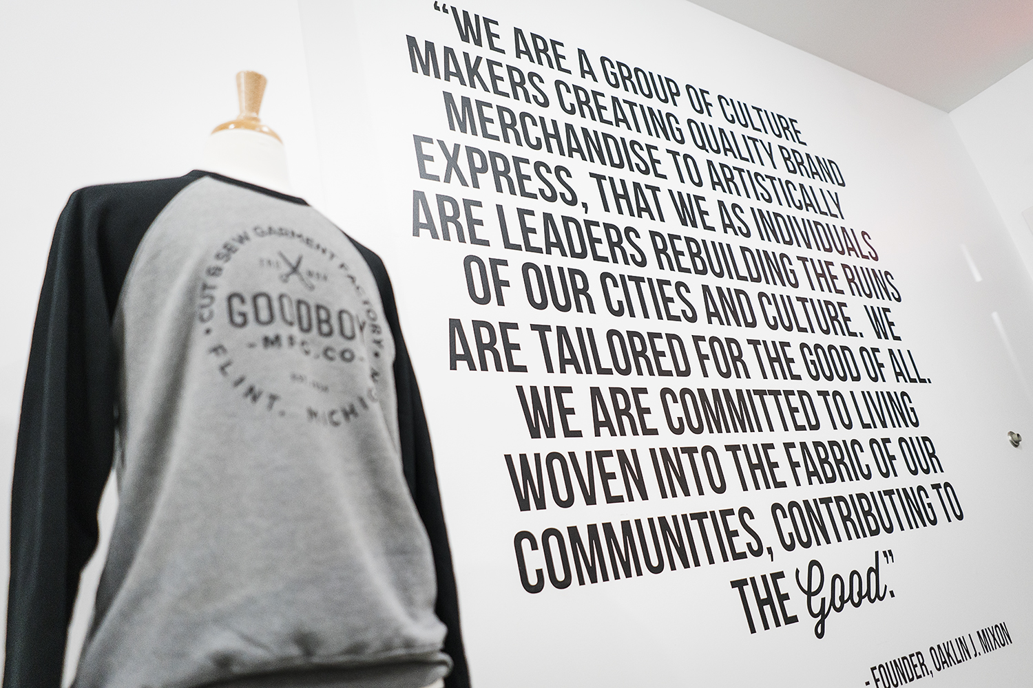 Vinyl graphics, photographs and other decorations are hung on the walls of the new GoodBoy Clothing showroom in preparation for the upcoming grand opening event on Friday, November 17, 2017 at GoodBoy Clothing in downtown Flint.