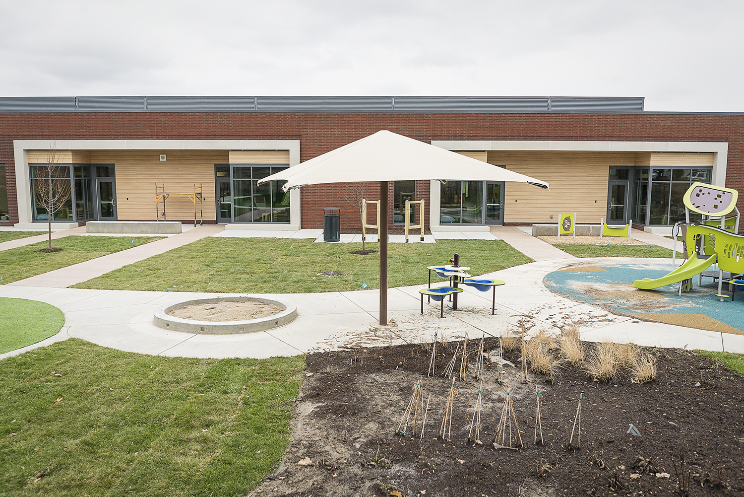 Flint, MI - Tuesday, November 21, 2017: New landscaping, activity centers and playscapes are being installed outside of the classrooms at the new Educare Center in Flint.