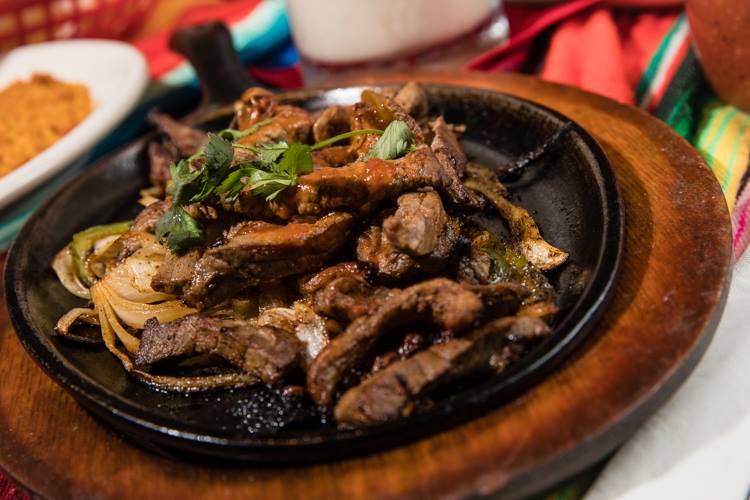 Fajitas at Soriano's Mexican Kitchen are available in chicken, steak, shrimp, three meat combo, or just vegetable.