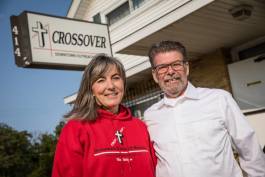 Denise Diller and Craig Leavitt pose outside Crossover Ministries current building at Grand Traverse and Court streets.