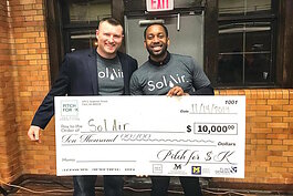 Jonathan Quarles holding his first place $10,000 win from November 2019's Pitch for $K event. 