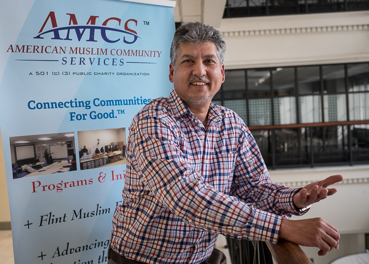 Adil Mohammed in the lobby of the NorthBank Center in downtown Flint where the American Muslim Community Services office is located.