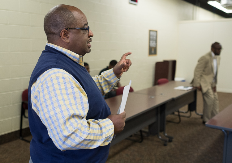 Advisor Robert Matthews of Flint leads the group in a discussion of human trafficking at the Alpha Esquires meeting earlier this month.