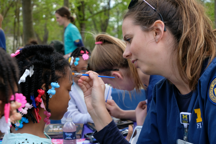 Nursing students from the University of Michigan-Flint volunteered to do face-painting during the Civic Park Summer Kickoff Celebration. 