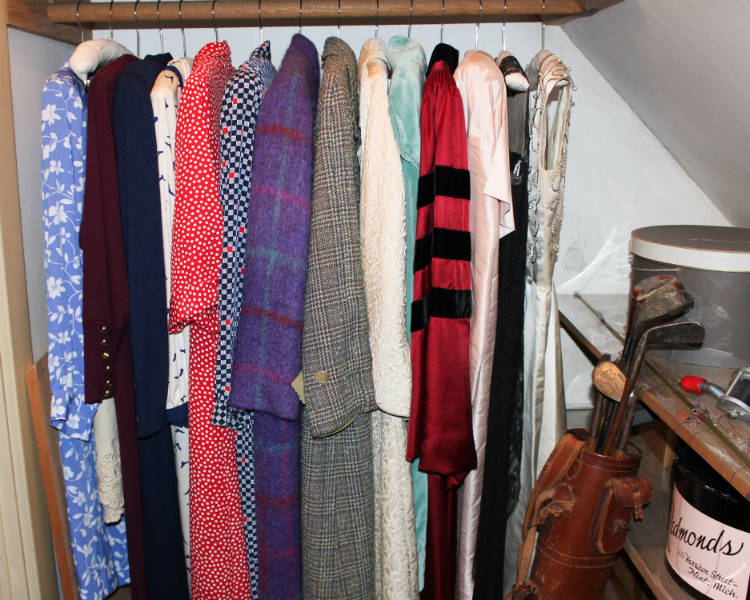 A peek inside one of the storage closets with Ruth Mott's dresses on the third floor of Applewood.