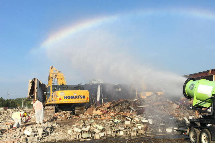 Water sprayed on a demolition site creates a rainbow at at Clio and Pierson roads in 2018. 