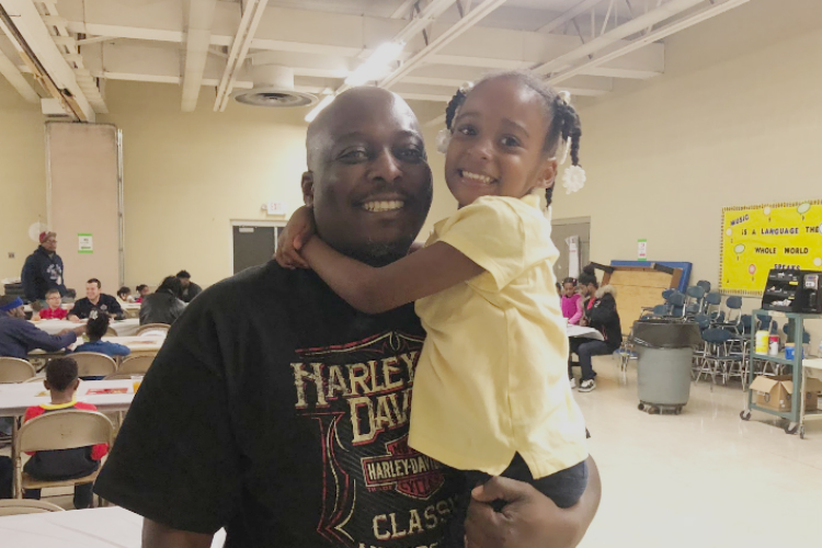 Monté Collins with his daughter, Brooke, 5, at Donuts with Dad at Durant-Tuuri-Mott Elementary. 