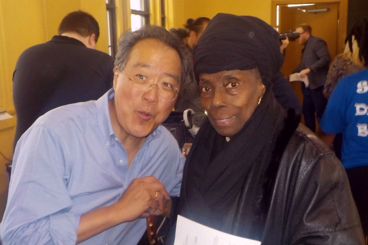 Yo-Yo Ma speaks with longtime community leader  E. Hill DeLoney during his visit to Flint.