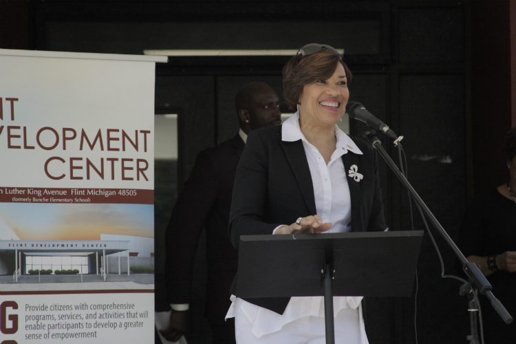 Flint Mayor Karen Weaver addresses the crowd during the ribbon-cutting ceremony for Flint Development Center on Thursday, June 8, 2017. 