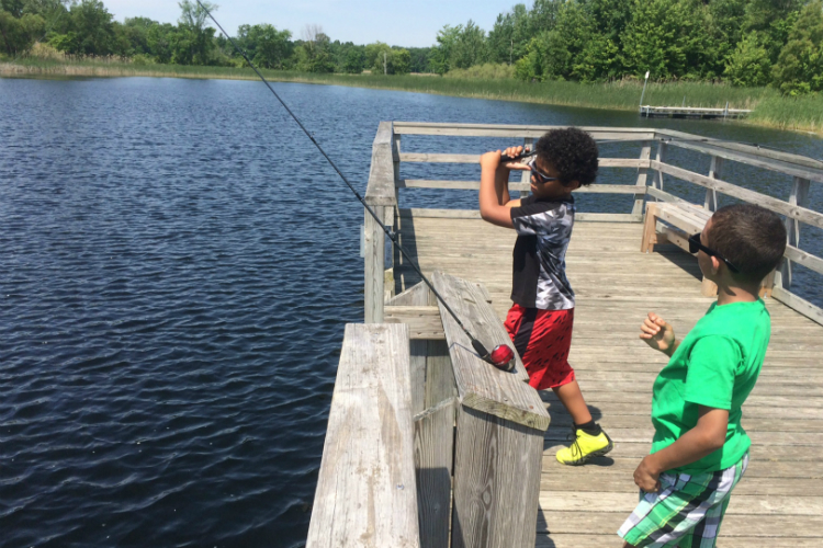 “Oh, wow,” said Javon (left) after his perfect first cast with his first and never-before-used fishing rod.