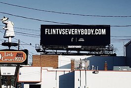 A FLINT VS EVERYBODY billboard on Ballenger Highway.