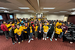 GEAR UP students from the International Academy of Flint and Flint Southwestern Classical Academy pose inside Central Michigan University's IAC with President Davies and Howard University Alternative Spring Break students on March 8, 2024. 
