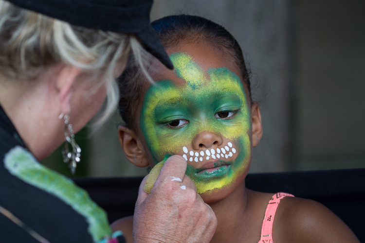 Maliyah Peterson, 7, of Grand Blanc has her face painted at the 8th Annual Miracle Picnic. She is the daughter of former MSU basketball standout and Flintstone Morris Peterson, who was there to support Hurley Children’s Center.