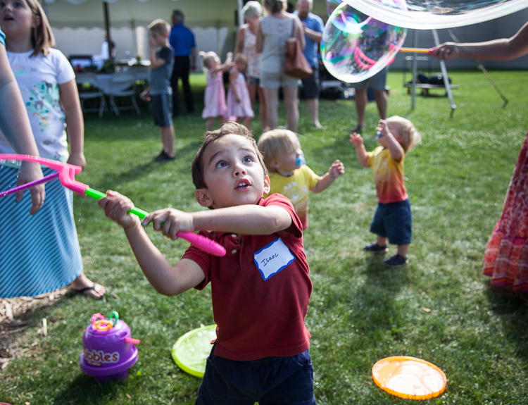 Isaac Sepanak, 3, of Linden swings at a bubble at the 8th Annual Miracle Picnic at the Sloan Museum. He was at the picnic with his mother, who is a nurse at Hurley.