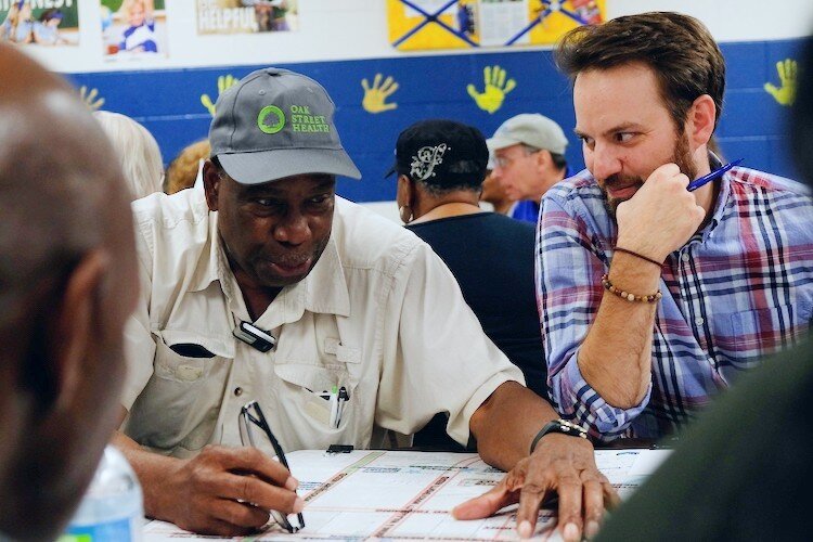 President of Civic Park Neighborhood Association, Joe King (left) explores a talking point with Lead Planner, Adam Moore during a focus group held for September 7 neighborhood planning meeting.
