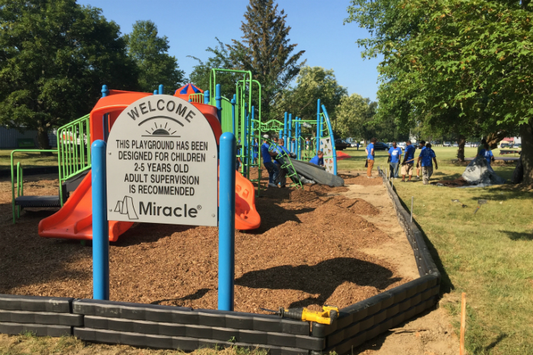 Volunteers helped a new playground open Tuesday at Hasselbring Senior Center. About 80 percent of the $150,000 funding comes from the Flint Child Health and Development Fund (often called FlintKids.org) and the Community Foundation of Greater Flint.