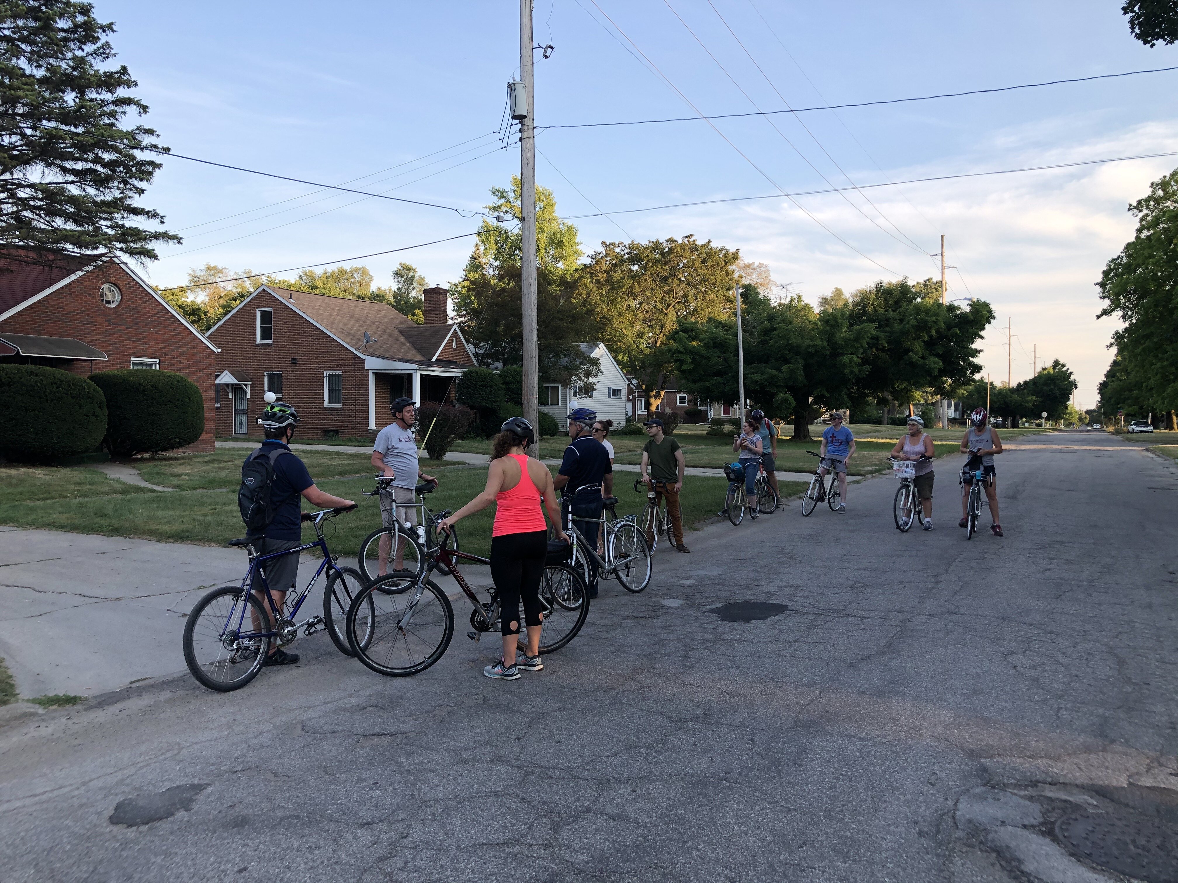 Thomas Henthorn discusses housing discrimination in Flint with participants on a Flint City Bike Tours tour in August.