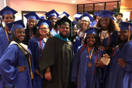 2018 graduates of Flint Southwestern Academy pose for a photo with Community School Director Mohammed Aboutawila after graduation in June.  