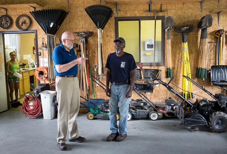 Hurb Pitts (right) talks about the condition of equipment with NEH board member Jim Richardson.