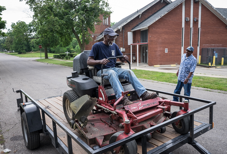 Hurb Pitts delivers a mower to Deacon Darris Berry at Shiloh Missionary Baptist Church.