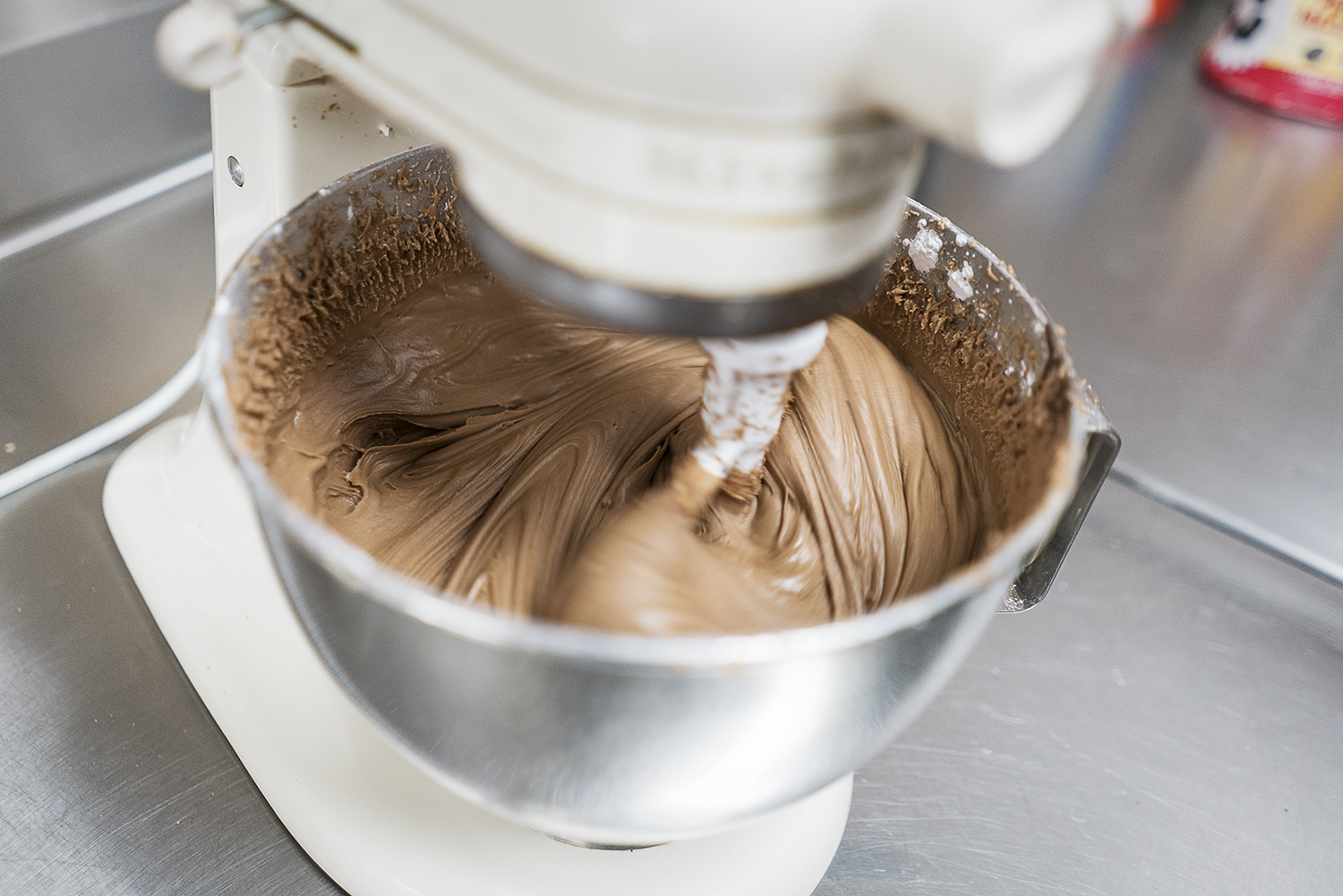 Chocolate filling is made in a stand mixer at Blueline Donuts at Carriage Town Ministries.