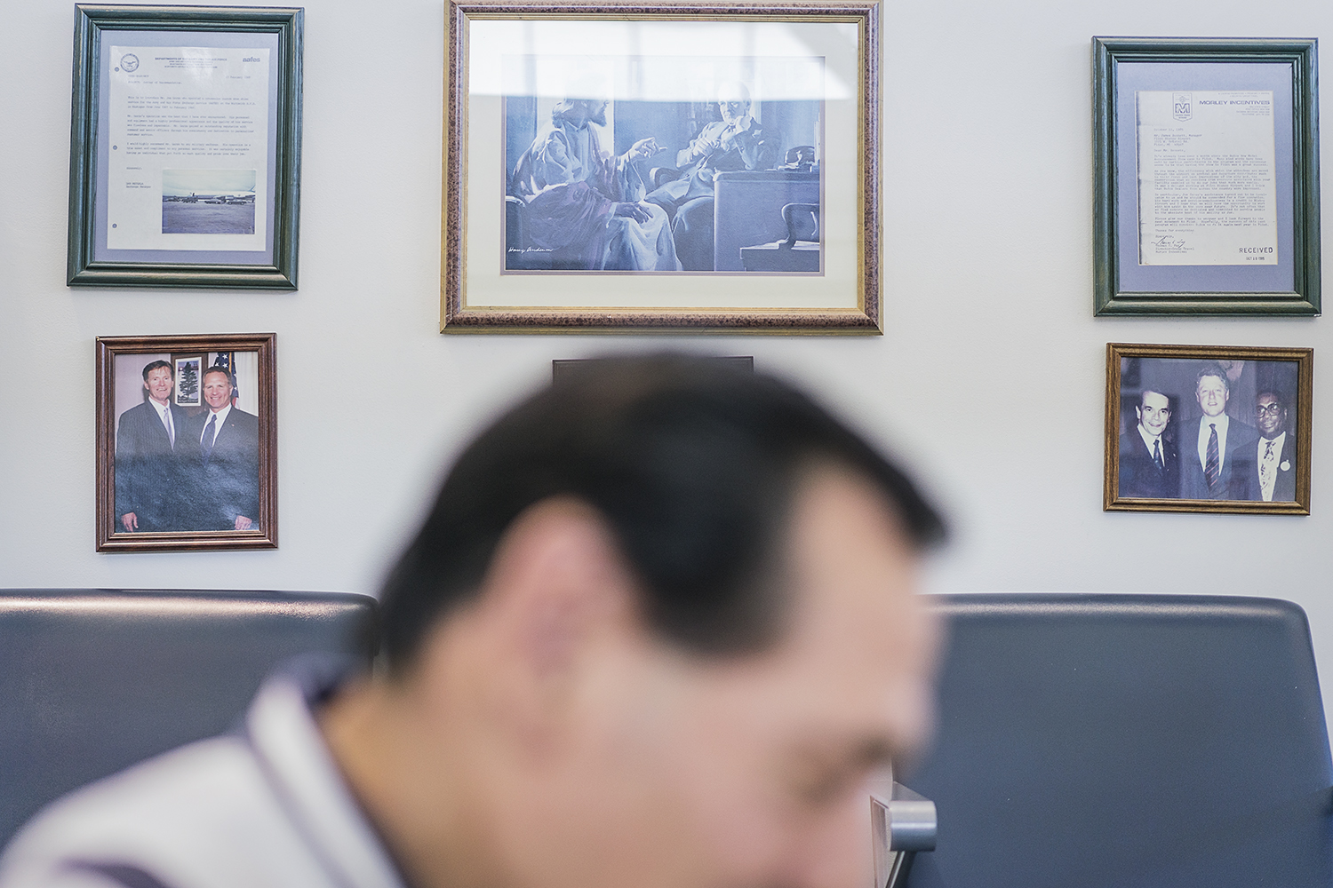 Flint, MI - Friday, January 26, 2018: Photographs, illustrations and letters adorn the walls of the shoe shine stand at Bishop International Airport.