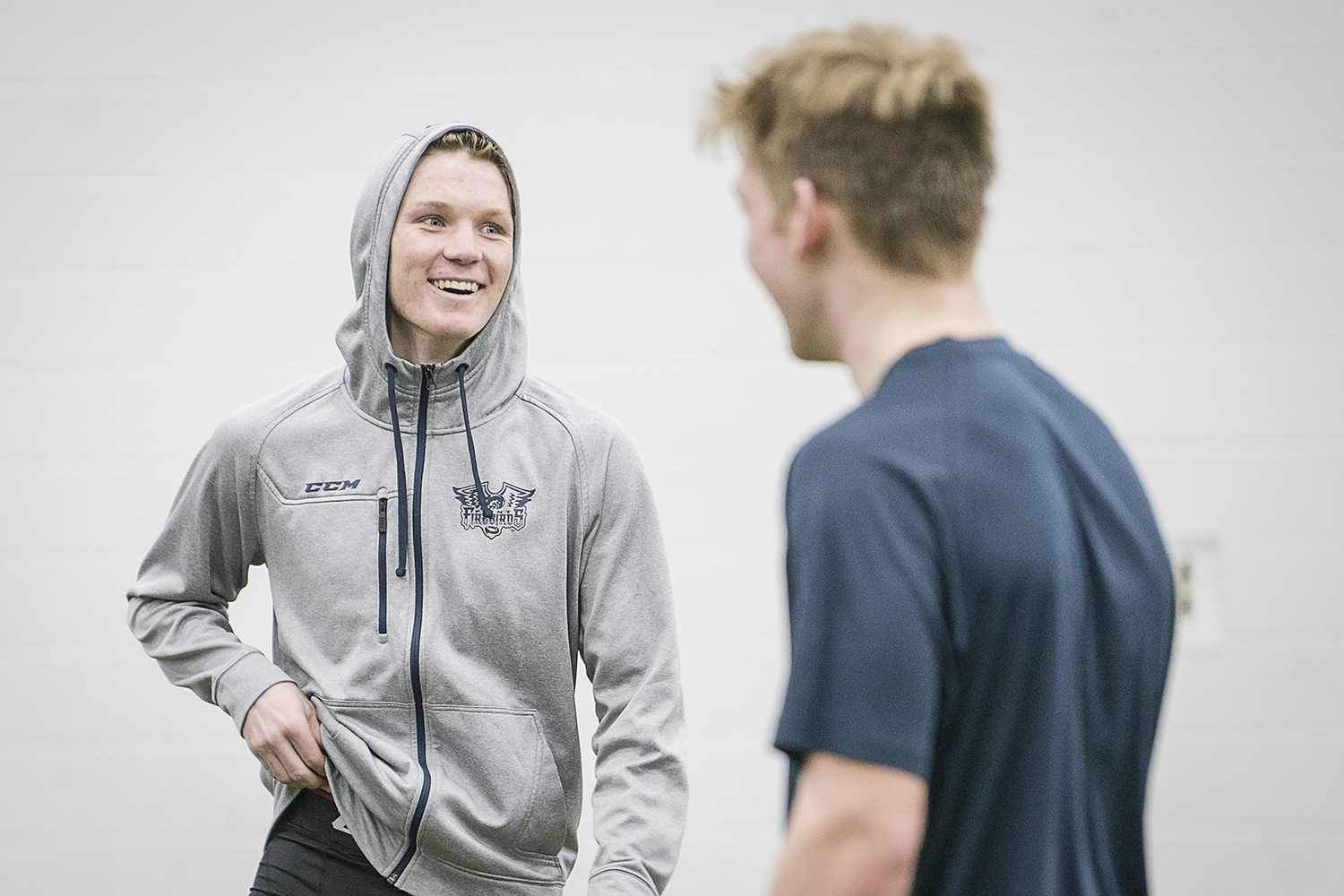 Flint, MI - Tuesday, January 30, 2018: Flint Firebirds' Ty Dellandrea (left), 17, laughs with teammates during post-practice recovery at the Dort Federal Event Center.