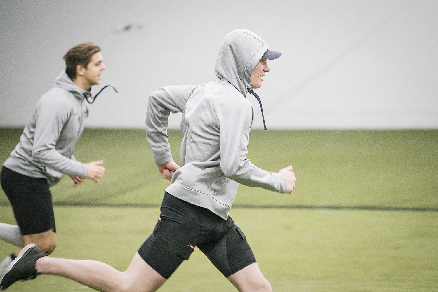 Flint, MI - Tuesday, January 30, 2018: Ty Dellandrea (right), Center for the Flint Firebirds, takes strides across the turf during post-practice recovery at the Dort Federal Event Center.