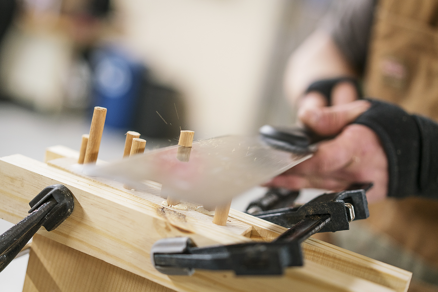 Flint, MI - Friday, February 2, 2018: Flint resident Michael Callahan trims down dowel rods before assembling a cabinet at Factory Two in Flint.