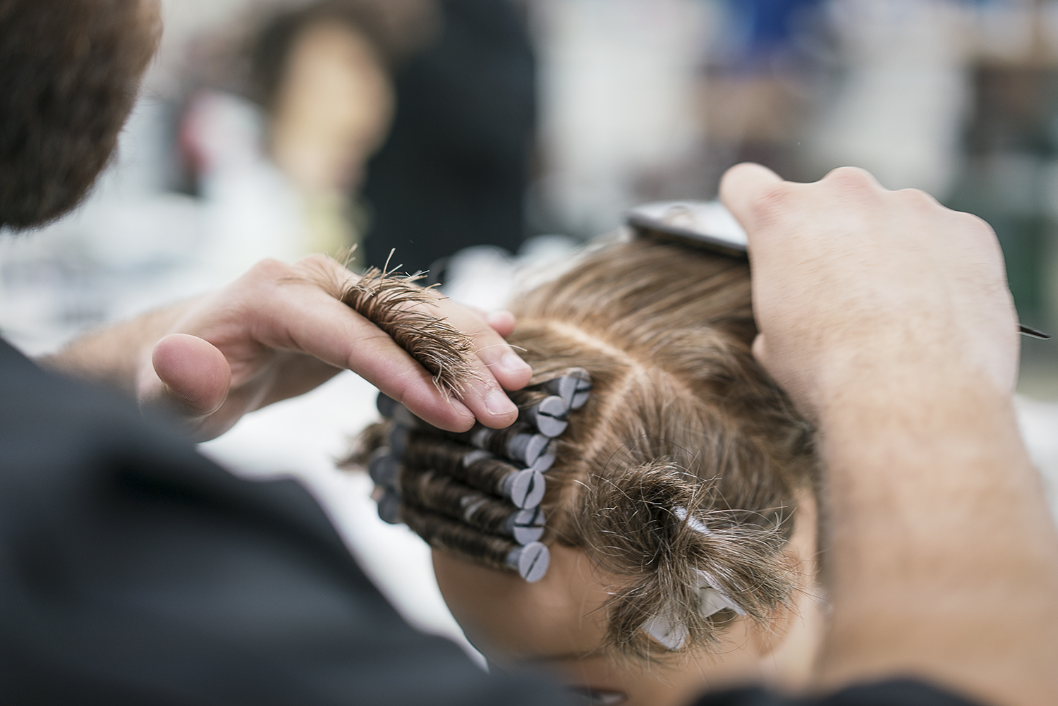 Flint, MI - Tuesday, February 6, 2018: Junior barber Cole Stomp, 19, from Davison, practices on a mannequin at the Flint Institute of Barbering.