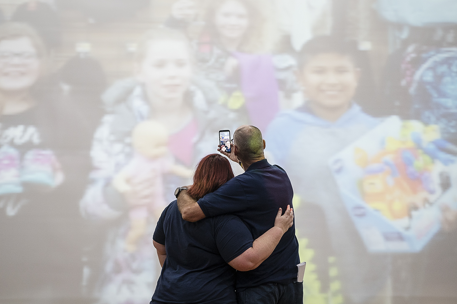 Flint, MI - Friday, May 4, 2018: FlintSide publisher Marjory Raymer, left, 44, from Flint and Blueberry Founder Phil Shaltz, 69, from Fenton Twp., take a selfie on stage before the beginning of the 5th Annual Blueberry Ambassador Awards Party at the 