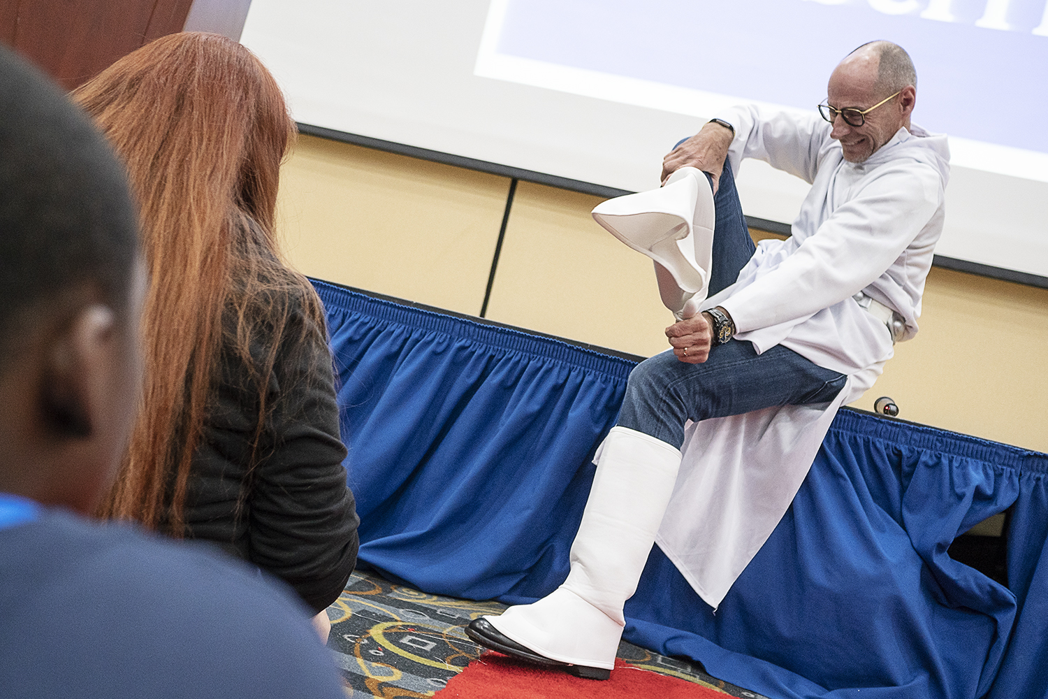 Flint, MI - Friday, May 4, 2018: Fenton Twp. resident and Blueberry Founder Phil Shaltz, 69, removes the Star Wars Princess Leia costume he donned while presenting the Blueberry Ambassadors with blueberry-replica stress balls during the 5th Annual Bl