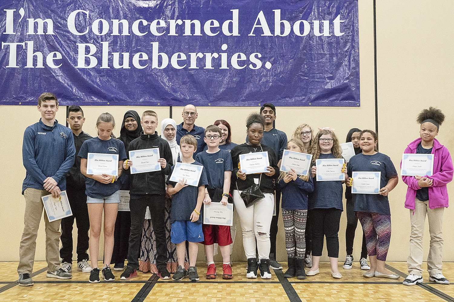Flint, MI - Friday, May 4, 2018: Blueberry Ambassador Blue Ribbon Award recipients stand on stage for a photograph during the 5th Annual Blueberry Ambassador Awards Party at the Riverfront Banquet Center downtown.