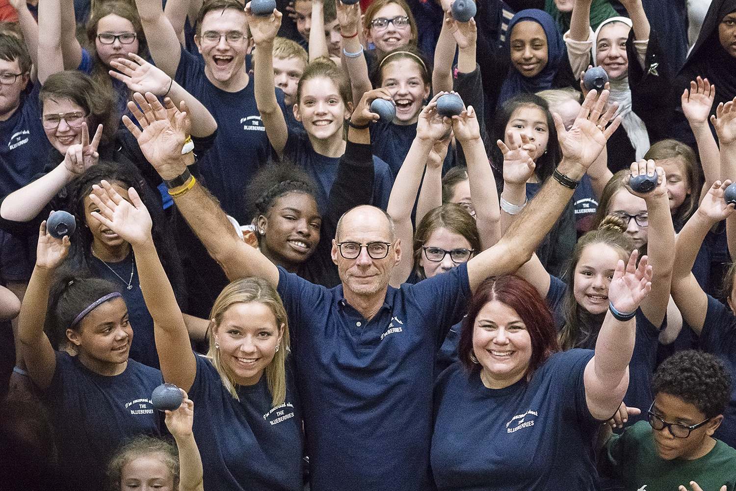 Flint, MI - Friday, May 4, 2018: Fenton Twp. resident and Blueberry Founder Phil Shaltz (center), 69, University of Michigan - Flint student Carryn White (left), 19, from Burton and FlintSide publisher Marjory Raymer (right), 44, from Flint, hold the