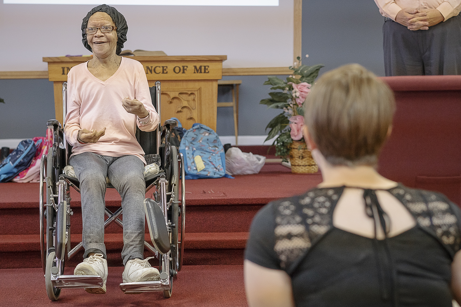 Annie Gaston, 67, of Flint addresses the congregation  at Master's House Deaf Church in Flint.