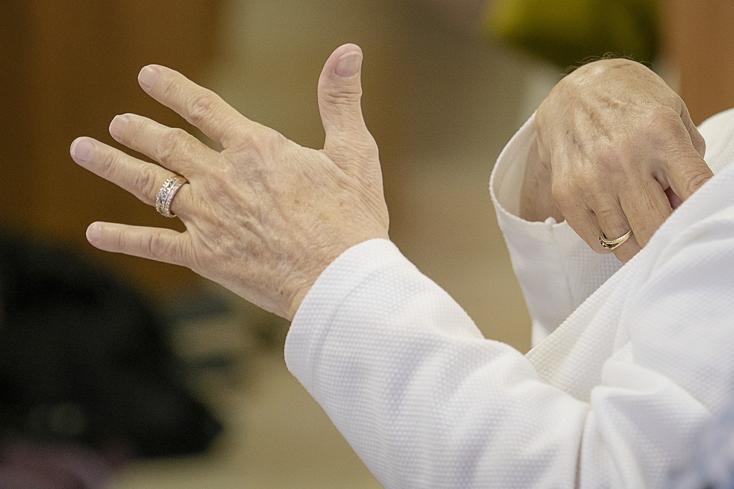 The congregation at Master's House Deaf Church in Flint sings along with their hands during service.