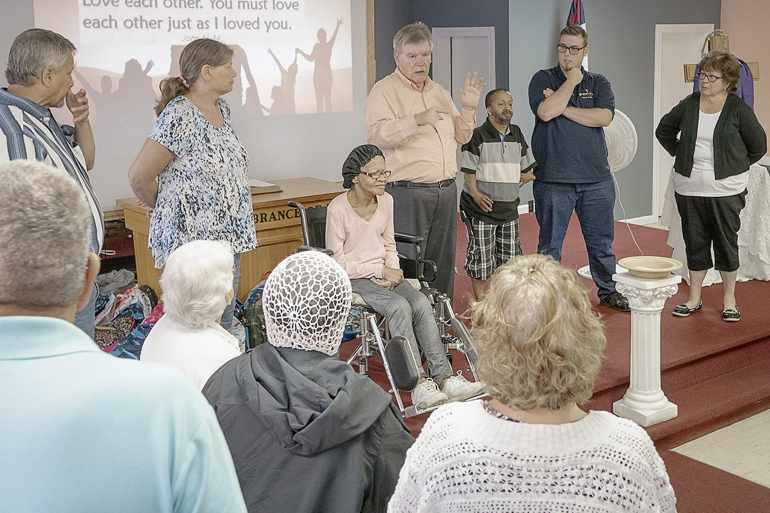 The congregation at Master's House Deaf Church in Flint gathers for a final blessing.