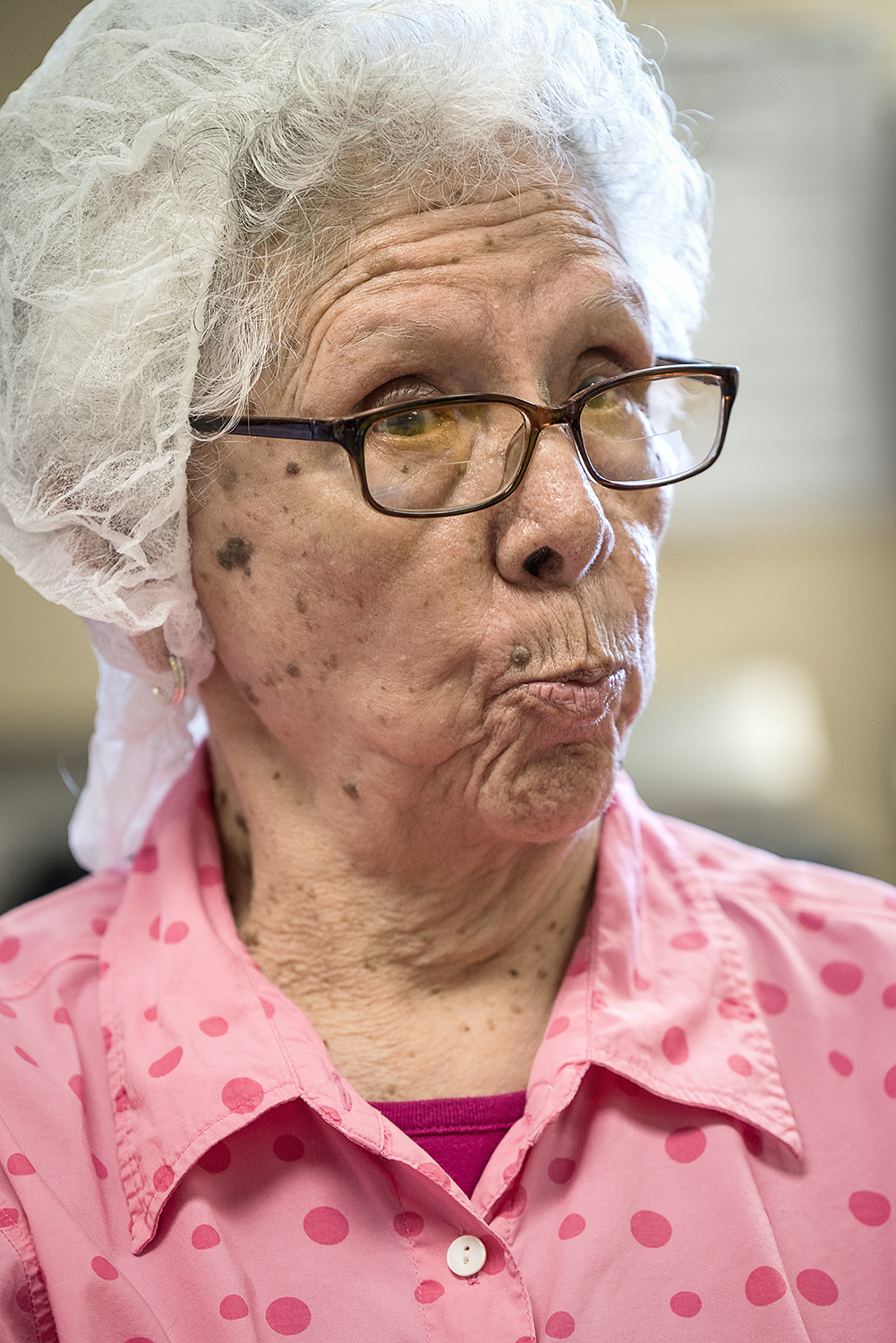 Connie Aguilar, 81, of Flint, reacts to the conversation swirling around the Tortilla Factory. 