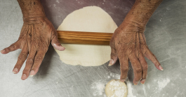 Ofelia Luna, 79, of Flint, rolls out masa to make tortillas, a weekly tradition at Our Lady of Guadalupe Catholic Church.