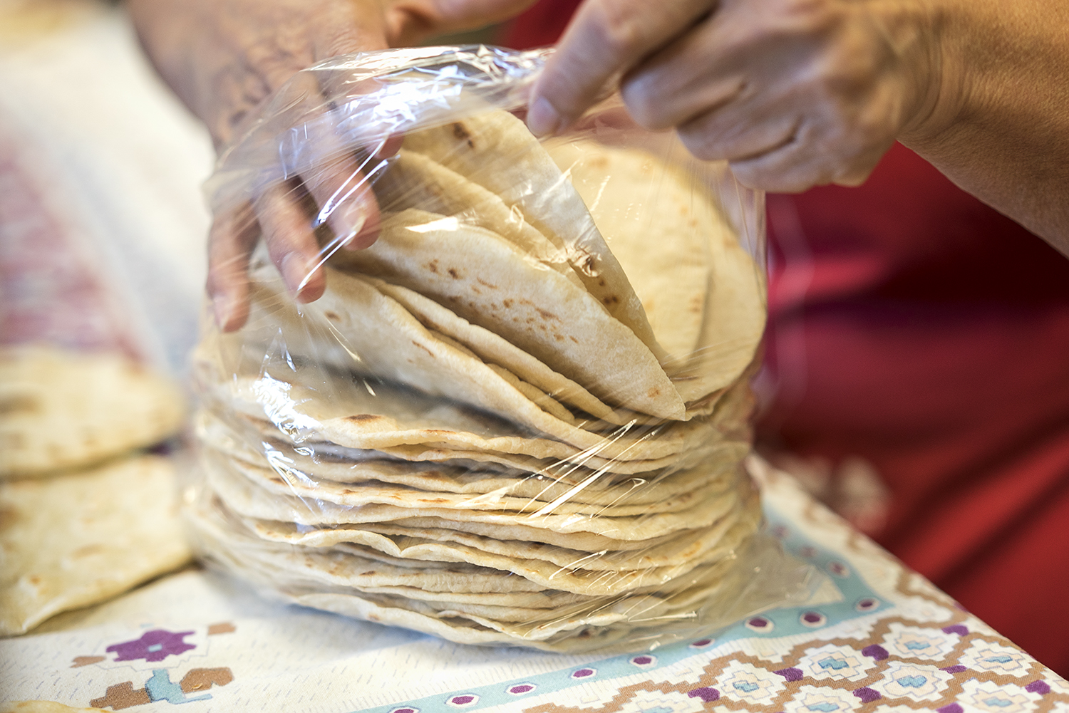 Tortillas are packaged two dozen at a time by Connie Rosas, 72, of Flint, in the kitchen at the San Juan Diego Activity Center at Our Lady of Guadalupe Catholic Church. 