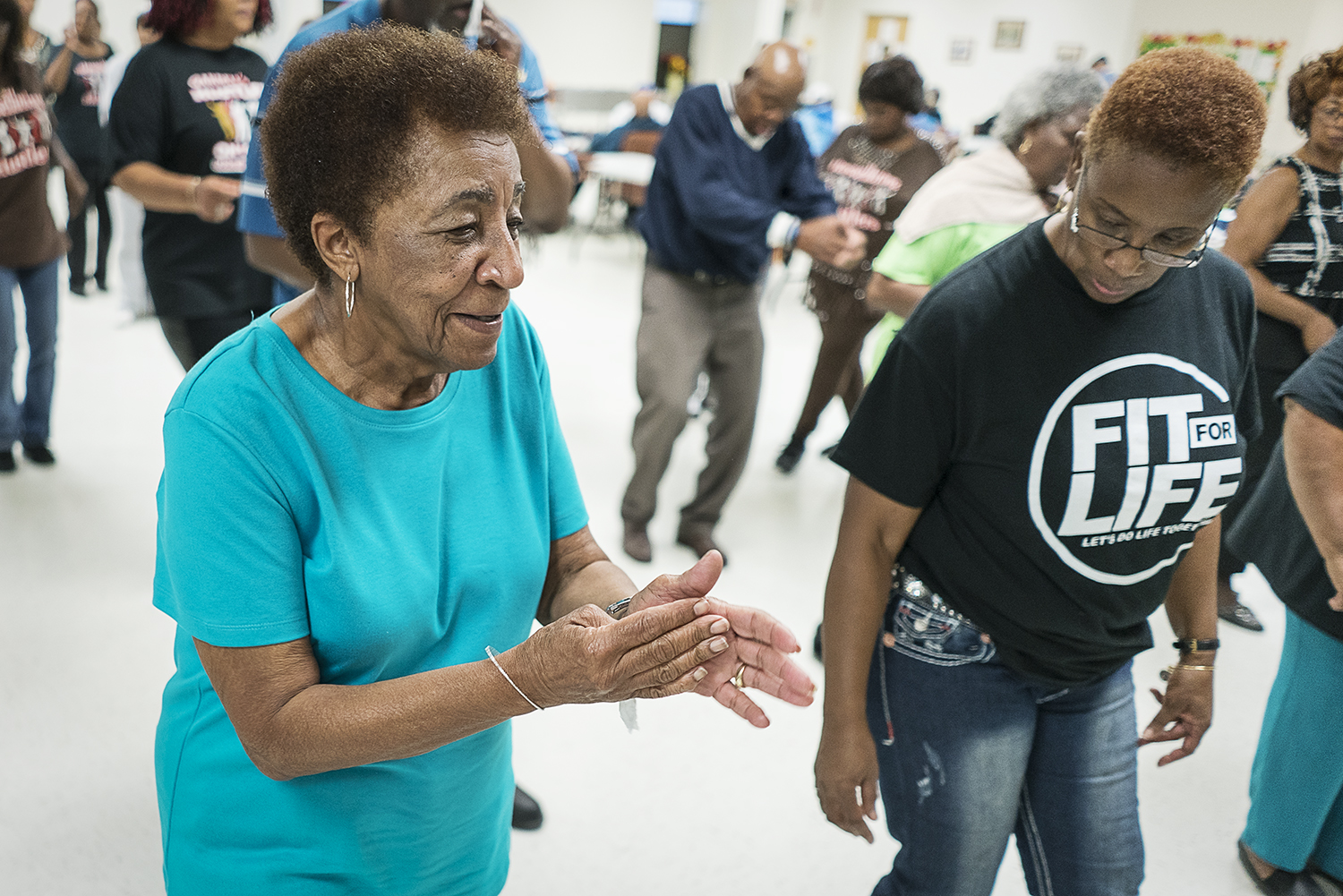 Flint residents Ruth Morris, 82, (left) and Queenella McGee, 66, dance together at the Hasselbring Senior Community Center. "I love coming because of these people," Morris says. "They're my sisters and brothers."
