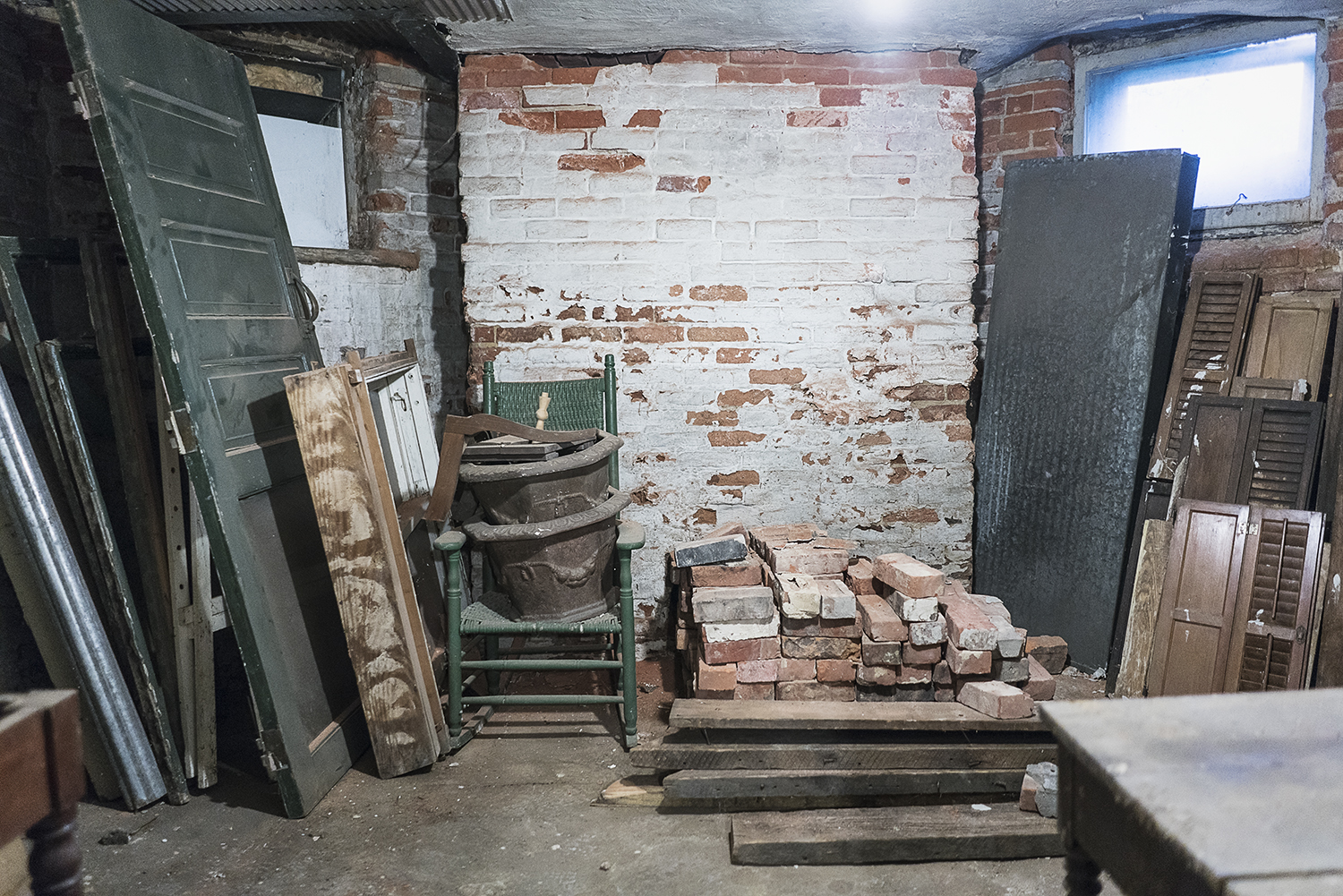 Flint, MI - Tuesday, October 31, 2017: Building materials are piled in a small corner of the basement of the Whaley Historic House Museum. 