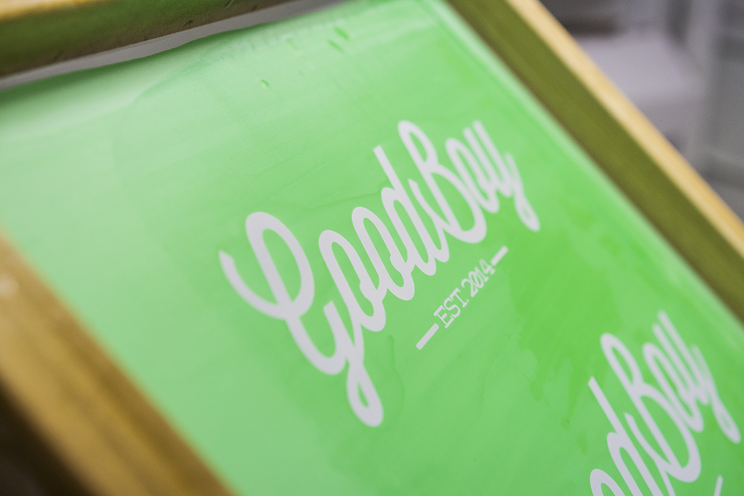 A screen printing press stands at the ready in the production area of the new GoodBoy Clothing storefront in downtown Flint.