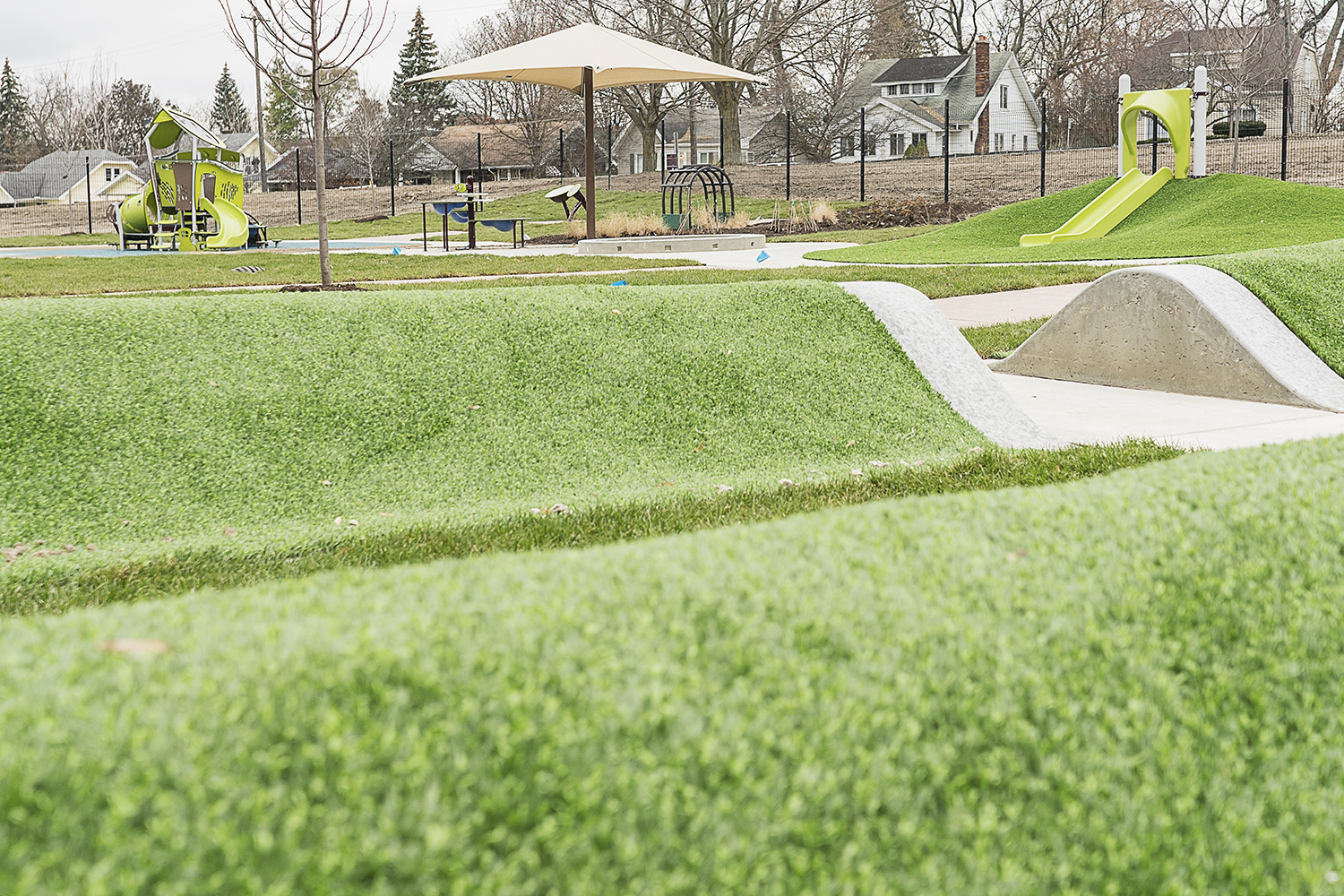 Flint, MI - Tuesday, November 21, 2017: Small rolling hills are just part of a large playscape outside of four classrooms at the new Educare Center in Flint.